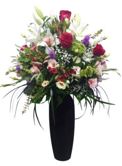 Charming Tall Glass Vase with Mixed Blooms